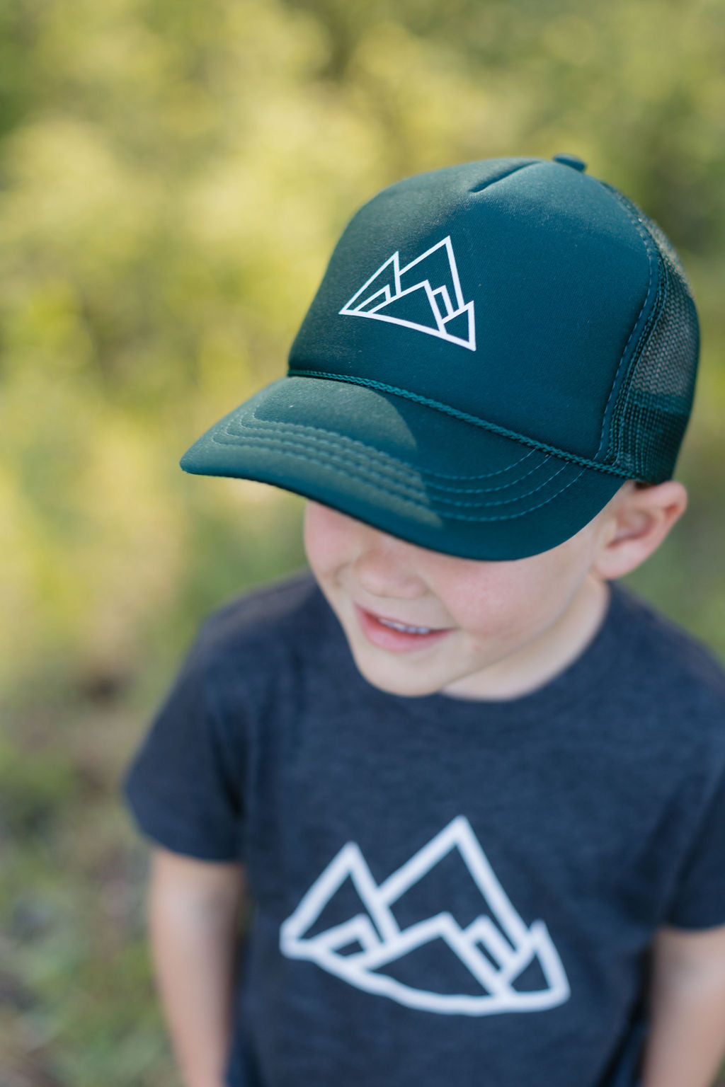 Kids Made of Mountains Logo Trucker Hat: Dark Green