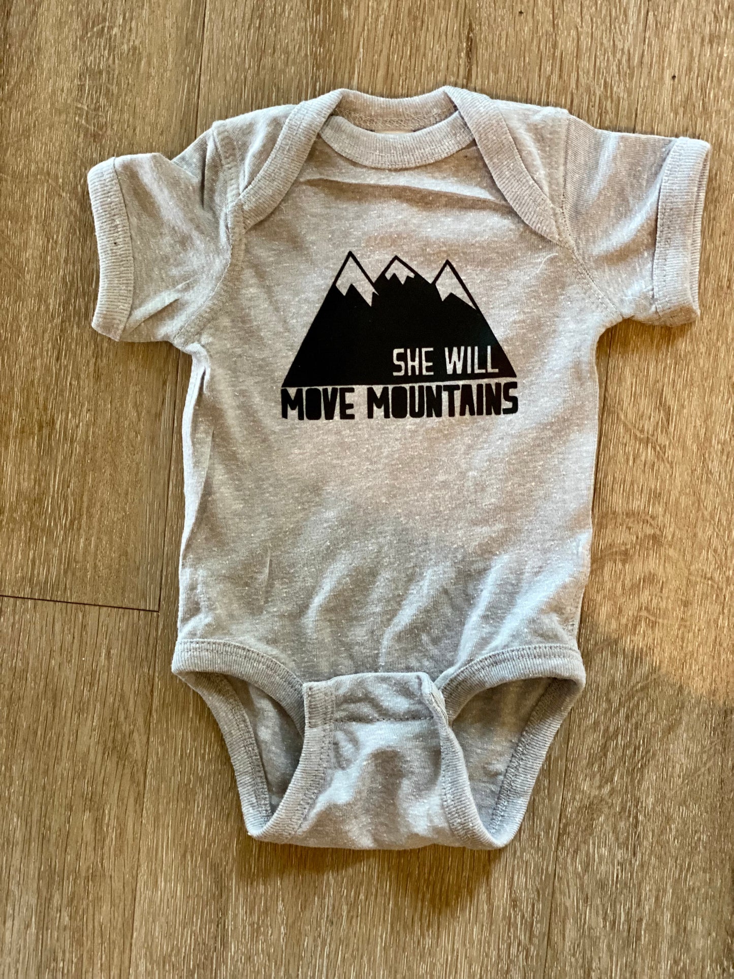 She Will Move Mountains Onesie